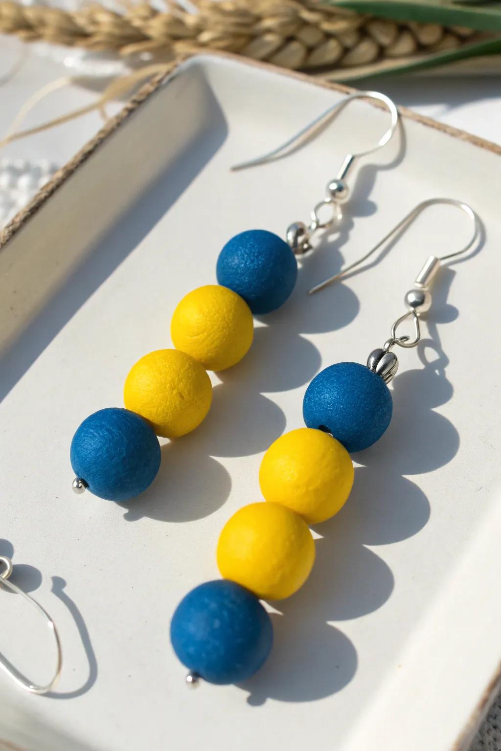 Infuse your style with daring hues using these handcrafted clay bead earrings, ideal for those who cherish minimalist grace with an energetic twist.