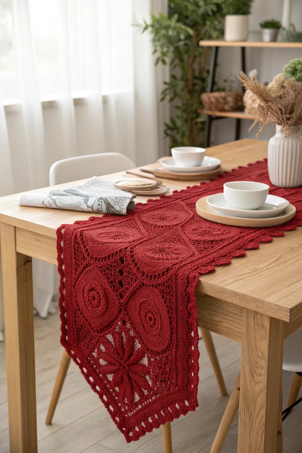 Impart a hint of warmth and grace to your dining space with a hand-fashioned scarlet crochet table runner.