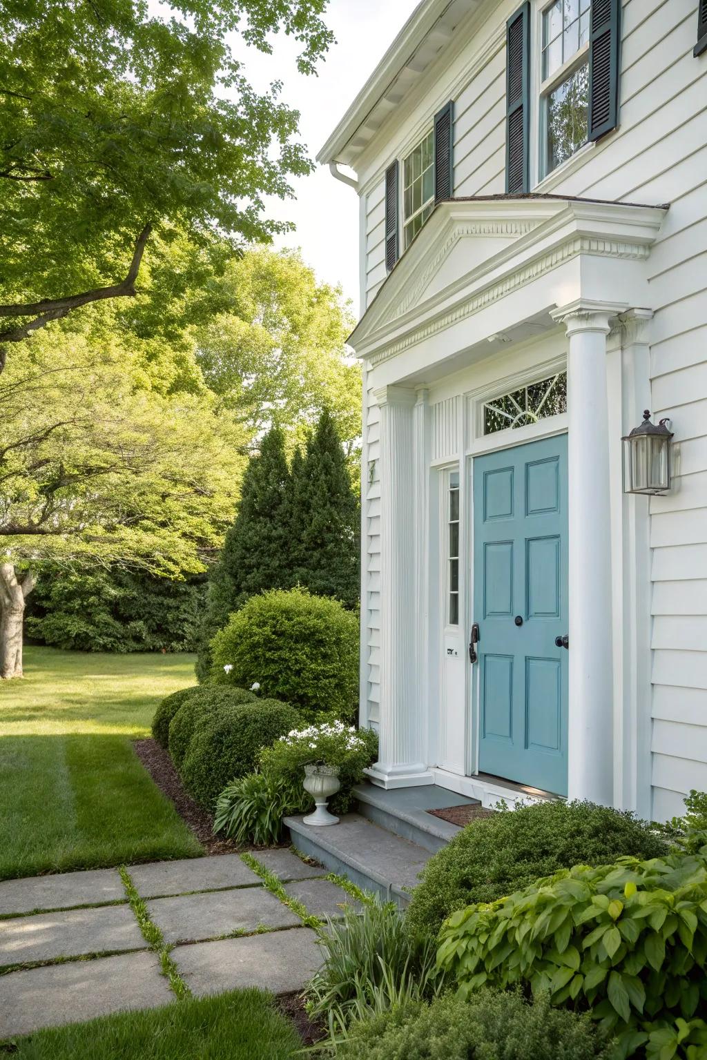 A gentle azure door delivers a distinctive and refreshing twist on traditional colonial colors.