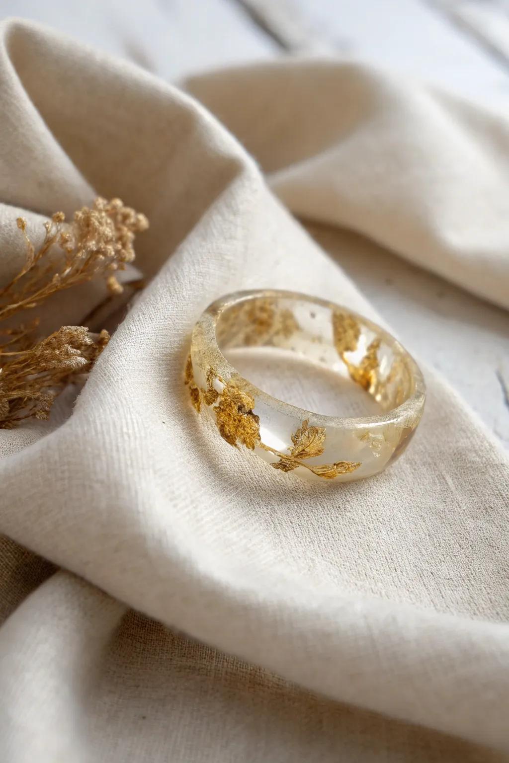 Uncover timeless elegance with this antique-inspired resin ring, where golden leaf converges with minimalist allure.