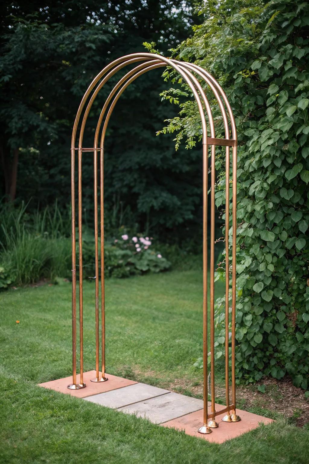 Embrace the elegance of brass with this stunning DIY garden arch, where minimalist design merges with organic beauty.
