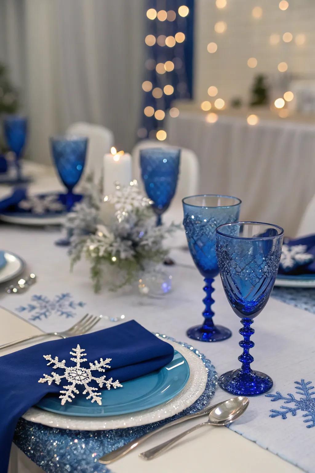Snowflakes and royal blue decor introduce a winter fairytale theme to the table.