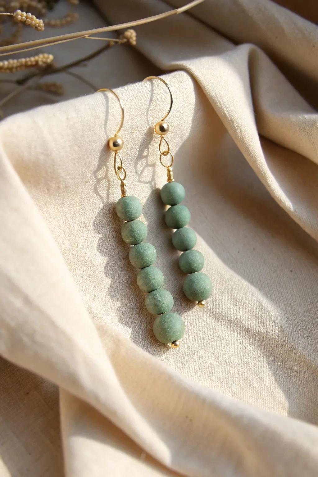 Uncover the beauty in simplicity with these handmade clay bead earrings.