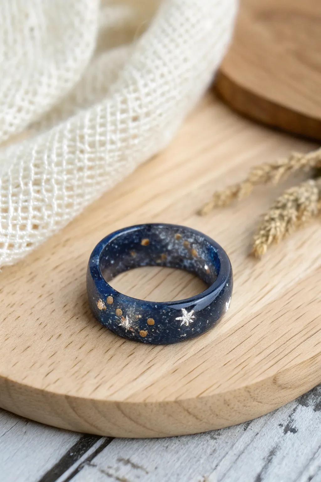 Capture the cosmos with this stunning resin ring, where dark depths converge with sparkling starlight.