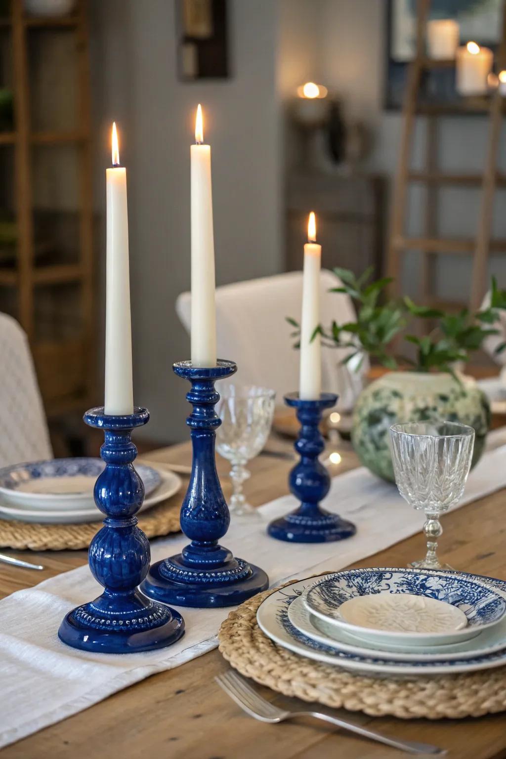 Royal blue light holders matched with ivory candles fashion a sophisticated and welcoming mood.
