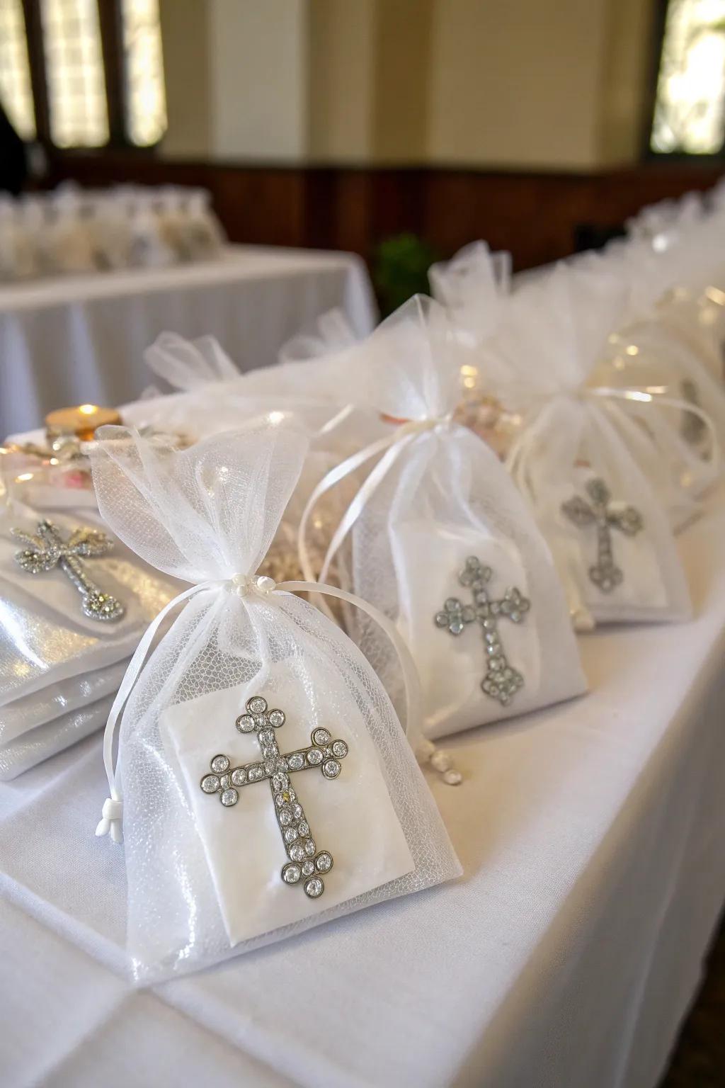 Diminutive crucifix adornments elegantly encased in organza sacks, impeccable as a baptismal favor.