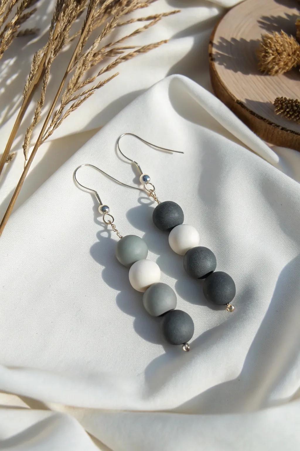 Upgrade your style with these chic monochrome clay bead earrings—where simplicity meets elegance.