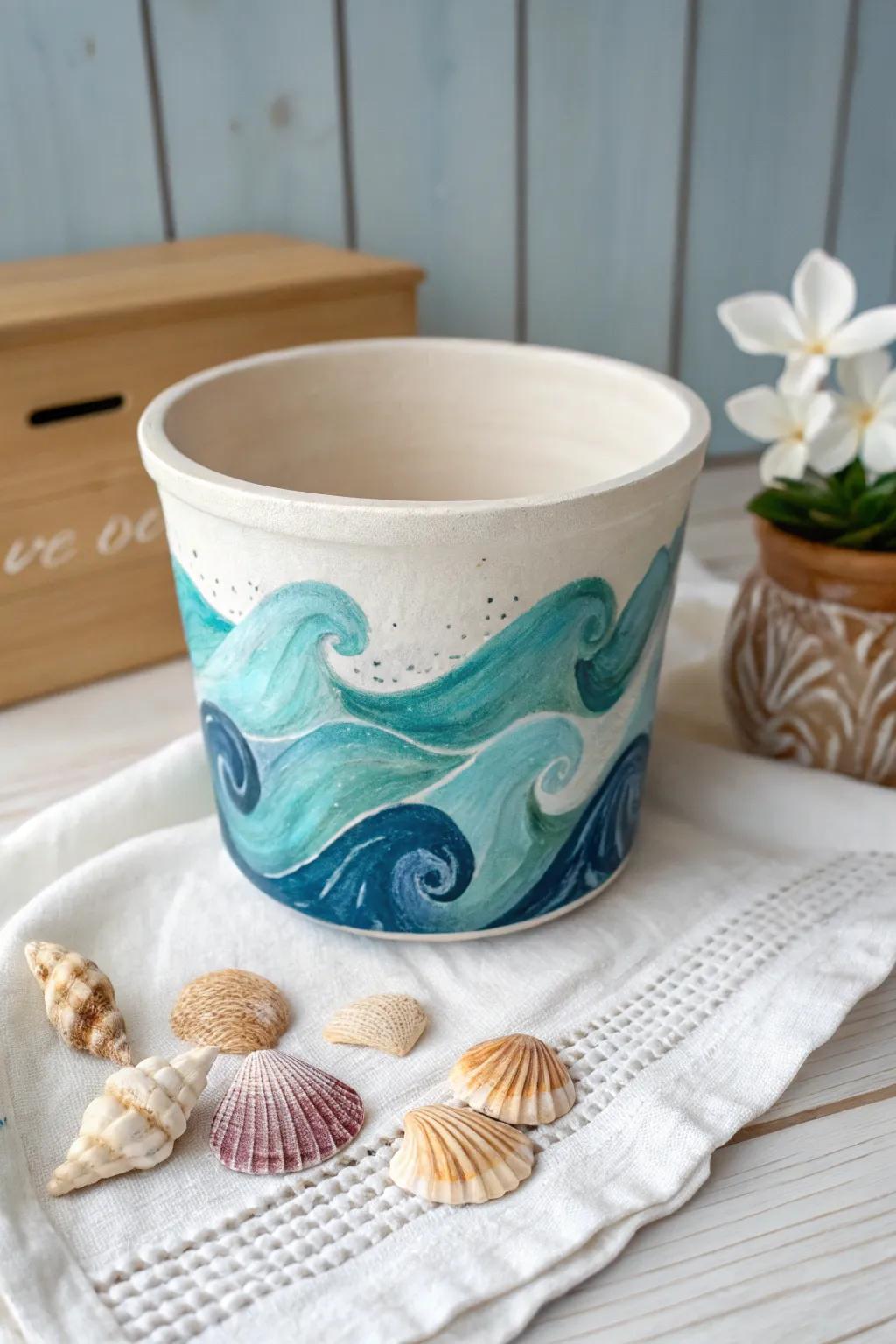 Immerse your home in the calming essence of the sea with this beautifully crafted ocean waves and seashells painted pot.