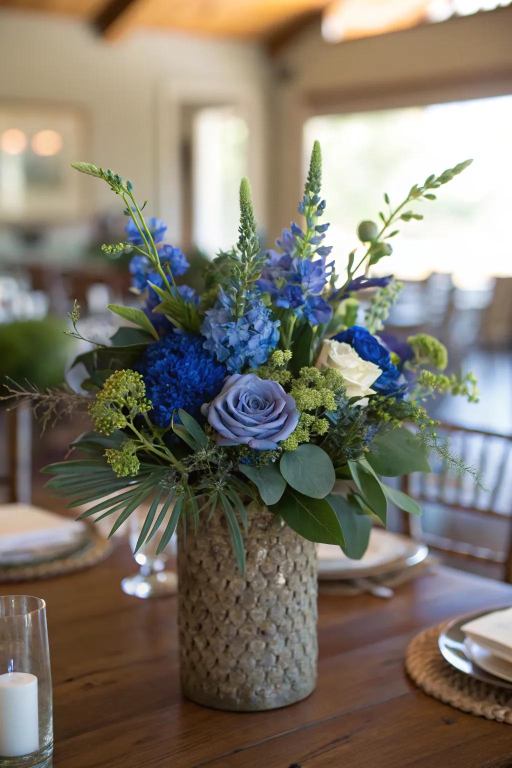 Uniting azure flowers with foliage generates a vibrant and natural centerpiece.