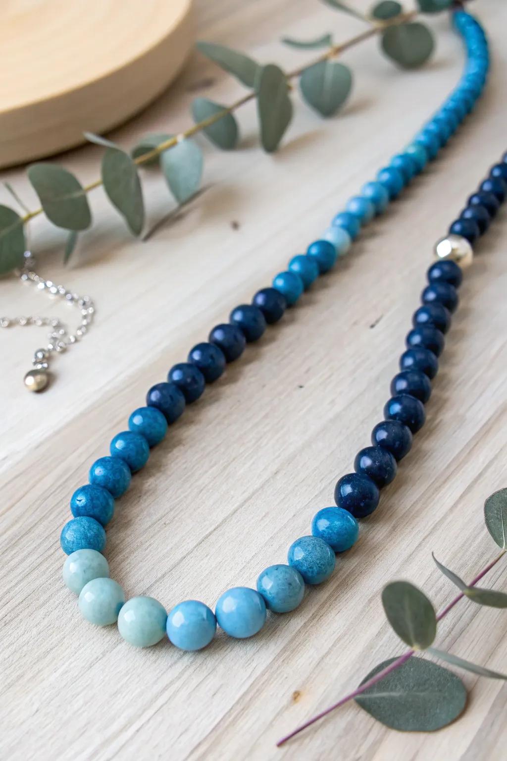 Rejoice in the serene beauty of harmonious hues with this sky-inspired beaded necklace.