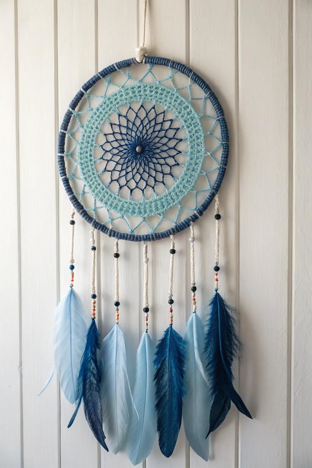 Embrace the tranquility of single-tone sophistication through this exquisitely crafted dream catcher in serene shades of blue.