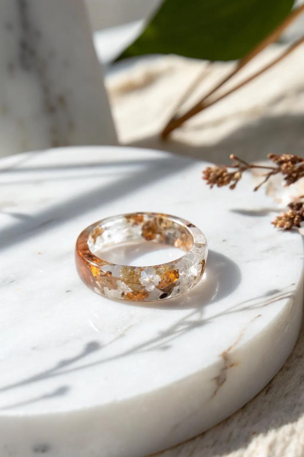 Elevate your aesthetic with a hint of opulence: Resin ring with metallic fragments.