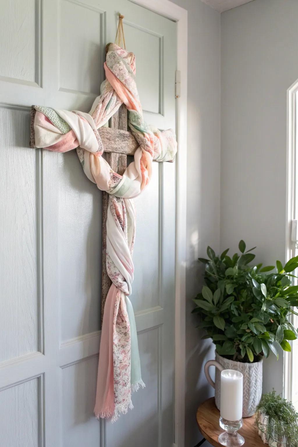 Embrace the artistry of simplicity using a textile-wrapped cross door decoration, where sustainability meets style.
